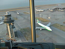 The view of the airport from the control tower, with an EVA Air Boeing 747 on a nearby taxiway