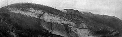 1907: Looking east at the CYMC quarry, west side of Yule Creek. Visible is the marble vein over one mile (1.6 km) wide with thickness of 169 feet (52 m)169 to 239 feet (73 m).