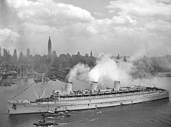 Nicknamed the "Grey Ghost", RMS Queen Mary holds the all-time record for most troops on one passage, 15,740 on a late July 1943 run from the U.S. to Europe.[3]