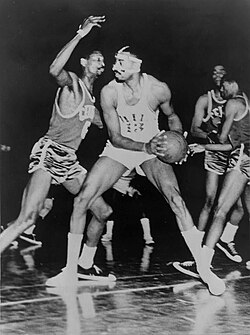 Bill Russell defending against Wilt Chamberlain in 1966