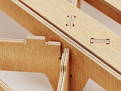 A detail of an open-source bedframe design, made from CNC-cut plywood