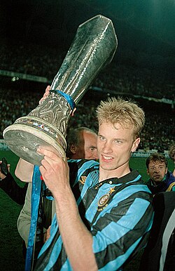 Bergkamp holding the UEFA Cup trophy after Inter Milan's win in the 1994 UEFA Cup final