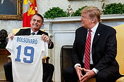 Former Brazilian President Jair Bolsonaro, sometimes called the "Tropical Trump", with United States President Donald Trump
