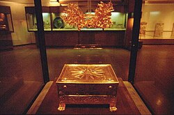 The Vergina Sun, the 16-ray star covering the royal burial larnax of Philip II of Macedon (r. 359–336 BC), discovered in the tomb of Vergina, formerly ancient Aigai