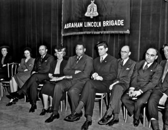 Robeson at an event honoring those killed in the Abraham Lincoln Brigade, February 26, 1941. Seated to his left is former Lincoln Battalion commander Milton Wolff.