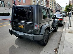 A black Jeep with license plate BAABAAA – a pun on "Baa, Baa, Black Sheep"