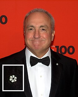 Lorne Michaels wearing the lapel pin of a Member (with magnified inset)