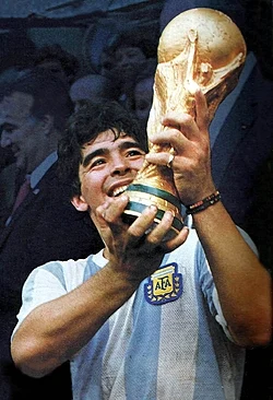 Diego Maradona celebrating with the Trophy. Argentina won the tournament unbeaten