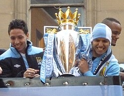 Nasri (left) and Sergio Agüero parade the Premier League trophy, May 2012