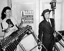 Buster Keaton and WAAB radio host Ruth Moss in an aluminum drive publicity photo for the Yankee Network, 1942.