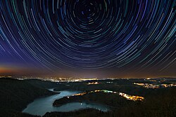 A typical star trail photograph taken in the Northern Hemisphere, with Polaris in the center