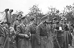 Hitler in Poland (September 1939). Rommel is on his left and Martin Bormann on his right.