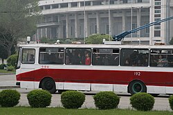 A trolleybus in Pyongyang with three distance stars, indicating it has gone over at least 150,000 kilometres (93,000 mi) safely.