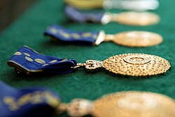 Several insignias for the Member of the Order of Australia (AM) to be granted