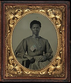 "Ambrotype of African American woman with flag," said to be a washerwoman for Union troops quartered outside Richmond, Virginia (Smithsonian 2005.0002.01)