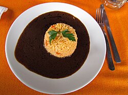 Mole sauce, which has dozens of varieties across the Republic, is seen as a symbol of Mexicanidad[363] and is considered Mexico's national dish[363]