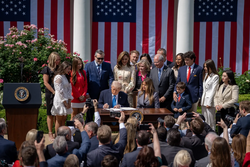 President Trump signing the TAKE IT DOWN Act into law on May 19, 2025
