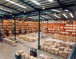 A warehouse implementing a pallet rack storage system