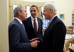 U.S. President Barack Obama (center) in the White House with two former presidents Bill Clinton (right) and George W. Bush (left) discussing the 2010 Haiti earthquake.