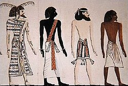A Libyan, a Nubian, a Syrian, and an Egyptian, drawing by an unknown artist after a mural of the tomb of Seti I, copied by Heinrich von Minutoli (1820). Note that the exaggerated skin shades are due to the 19th century illustrator, not the Ancient Egyptian original.