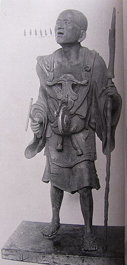 Statue of Kūya by Kōshō, son of Unkei, dating to the first decade of the thirteenth century. The six syllables of the nembutsu, na-mu-a-mi-da-butsu, are represented literally by six small Amida figures streaming from Kūya's mouth.