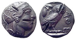 On this tetradrachm of Athens, struck in the mid 5th century BC, the head of Athena is regarded as the obverse because of its larger scale and portrait; the entire owl is depicted in a smaller scale on the reverse. Legend: ΑΘΕ[ΝΑΙOΝ], ie "of Athenians".