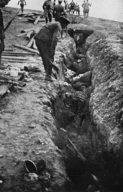 Dead Russian soldiers in a trench near Usdau