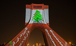 Azadi Tower, in Iran, lit up with the colours of the Lebanese flag on 6 August 2020
