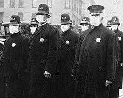Seattle policemen wearing cloth face masks handed out by the American Red Cross during the Spanish flu pandemic, December 1918