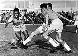 Garrincha (left), Brazilian winger and 1962 World Cup star, is regarded as one of the greatest dribblers of all time.[9]