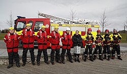 Firefighters of the Scottish Fire and Rescue Service with Minister for Community Safety and Legal Affairs, Annabelle Ewing, on its fifth anniversary in operation, 2018