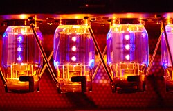 The glow from four KT88 model "Electro Harmonix" brand power tubes lights up the inside of a Traynor YBA-200 guitar amplifier