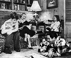 The Comos at home c. 1955. On the sofa are his elder son Ronnie and wife Roselle. In the chair is his daughter, Terri, and on the floor are Perry and son David.