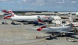 British Airways Airbus A318-100 alongside two Boeing 747-400s at John F. Kennedy International Airport. This aircraft operated the special all-business class Club World London City service between London and New York.