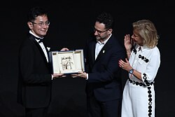 Goro Miyazaki accepting the honorary Palme d'Or at the 2024 Cannes Film Festival