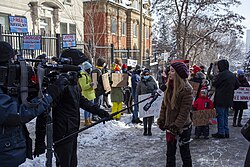 CBC News journalist and camera crew reporting on a rally in support of Alexei Navalny outside the Russian consulate in Montreal, January 2021
