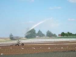 A traveling sprinkler at Millets Farm Centre, Oxfordshire, United Kingdom