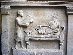 Slave holding writing tablets for his master (relief from a 4th-century sarcophagus)