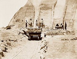 Workers load guano onto a cart in 1865