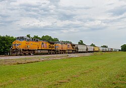 GE AC4400CW Union Pacific #6419, in Checotah, Oklahoma, with the Flags and Flares paint scheme leads a train on June 26, 2021
