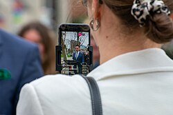 A candidate being livestreamed with a smartphone, in the 2022 Hamilton, Ontario, municipal election
