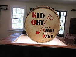 Bass drum used by drummer Ram Hall in Kid Ory's Creole Jazz Band, with front head painted promoting the band, on display at 1811 Kid Ory Historic House, LaPlace, Louisiana