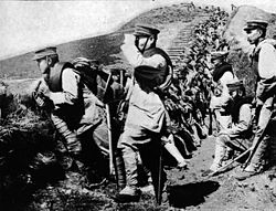 Japanese soldiers occupy a captured German trench during the Siege of Tsingtao, 1914