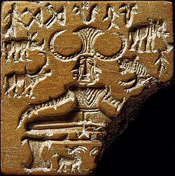 The Pashupati seal, showing a seated figure that is surrounded by animals, including the Indian rhinoceros (c. 2350–2000 BCE)