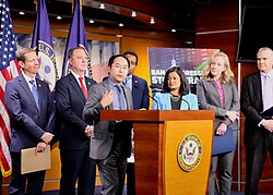 Kim speaking at a press conference supporting a ban on Congressional stock trading in May 2023