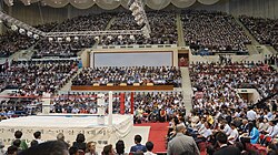 Spectators gather in Pyongyang, North Korea for Antonio Inoki's Pro Wrestling Friendship Games. A traditional wrestling ring can be seen in the lower left corner.