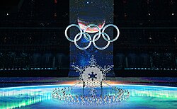 A scene from the opening ceremony; in lieu of a cauldron, the Olympic torch was mounted in the centre of a large snowflake sculpture