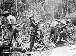 British troops firing a mortar on the Mawchi road, July 1944
