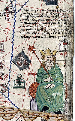 Kublai Khan in the Catalan Atlas (1375). The caption reads:"The most powerful prince of the Tartars is named Holubeim [Kubilay Khan], which means Great Khan. This emperor is richer than any other emperor in the world. This emperor is protected by twelve thousand horsemen with their four captains that stay at the court three months of the year."[33]