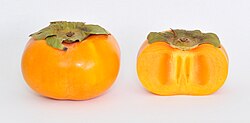 A whole Jiro persimmon fruit and a cross-section